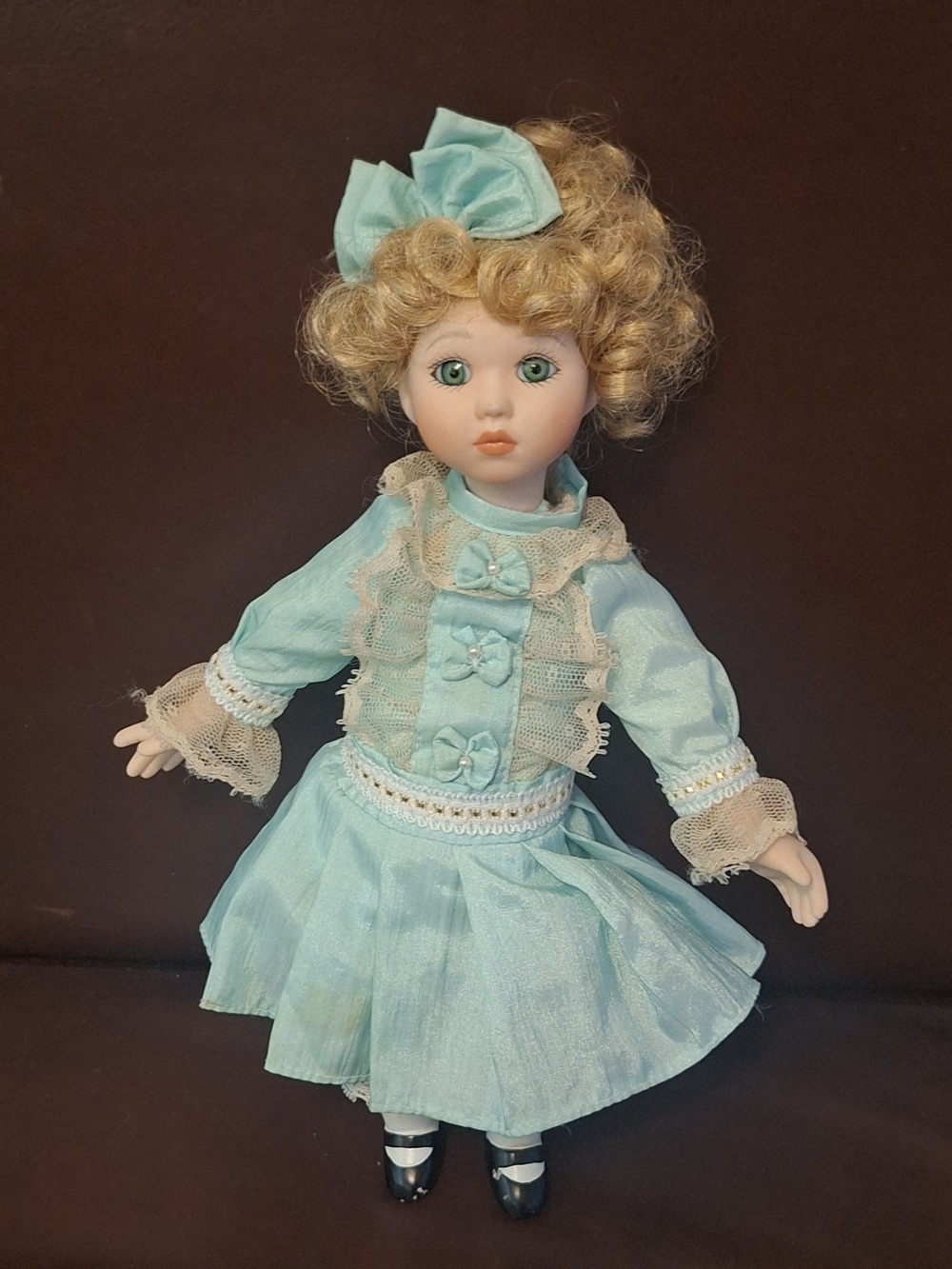 Porcelain Curly Hair  Doll With Cloth Body in Light Blue Dress with Bow In Hair